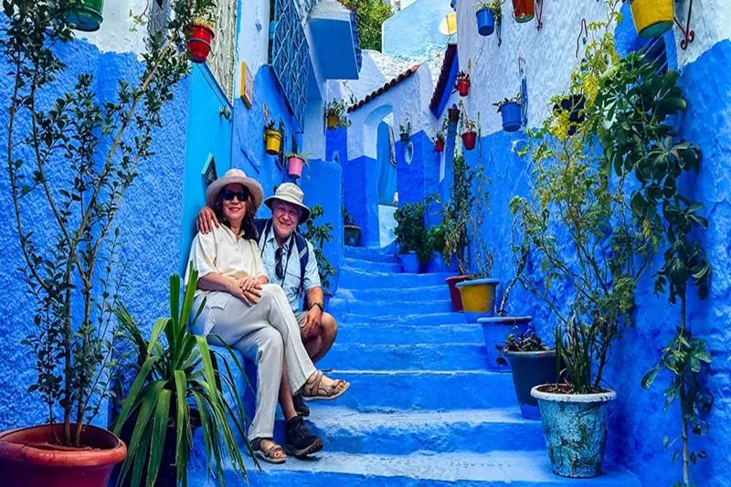 Blue-washed stairway and flower pots in the medina of Chefchaouen